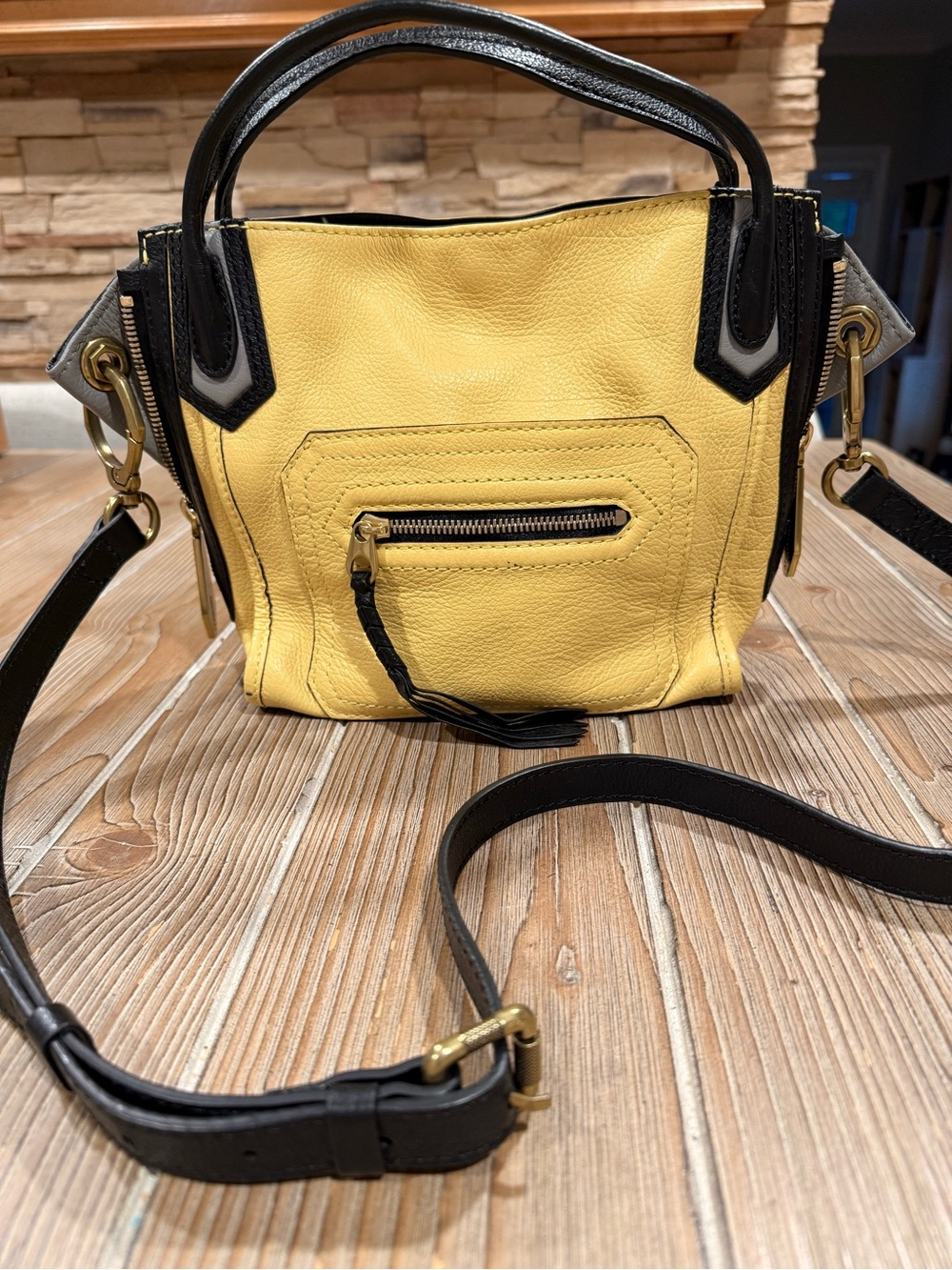 orYANY Mini Ruby Convertible Crossbody Bag in a striking yellow, black, and gray